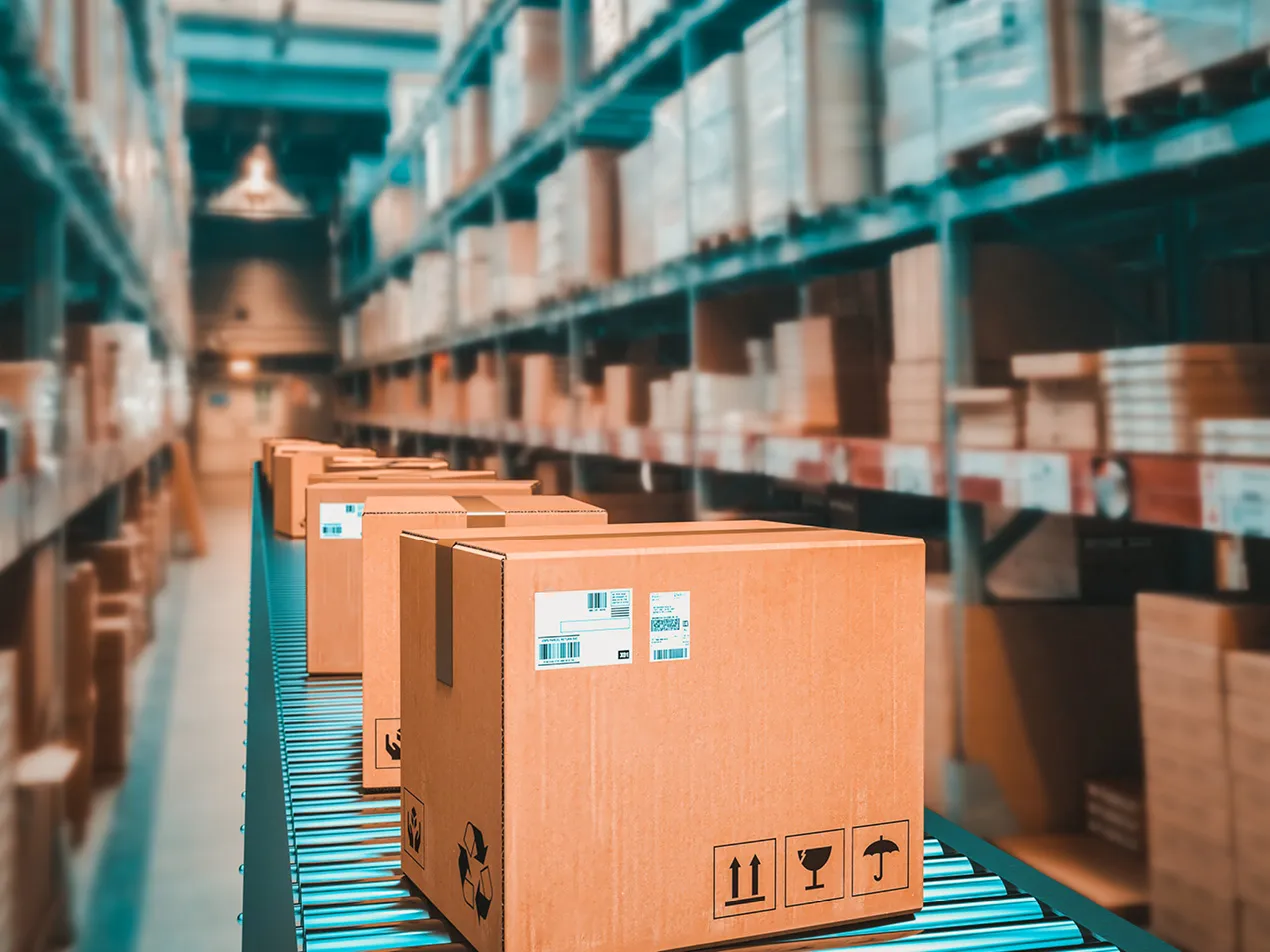 boxes on conveyor belt in warehouse
