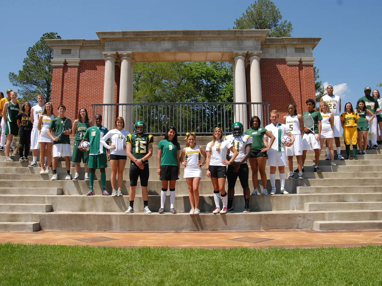 belhaven athletes posed in front of the pavilion