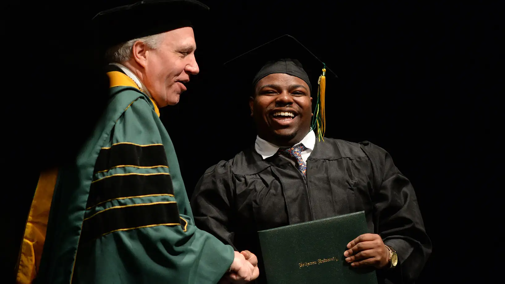 Dr. Parrott with a trad student at graduation