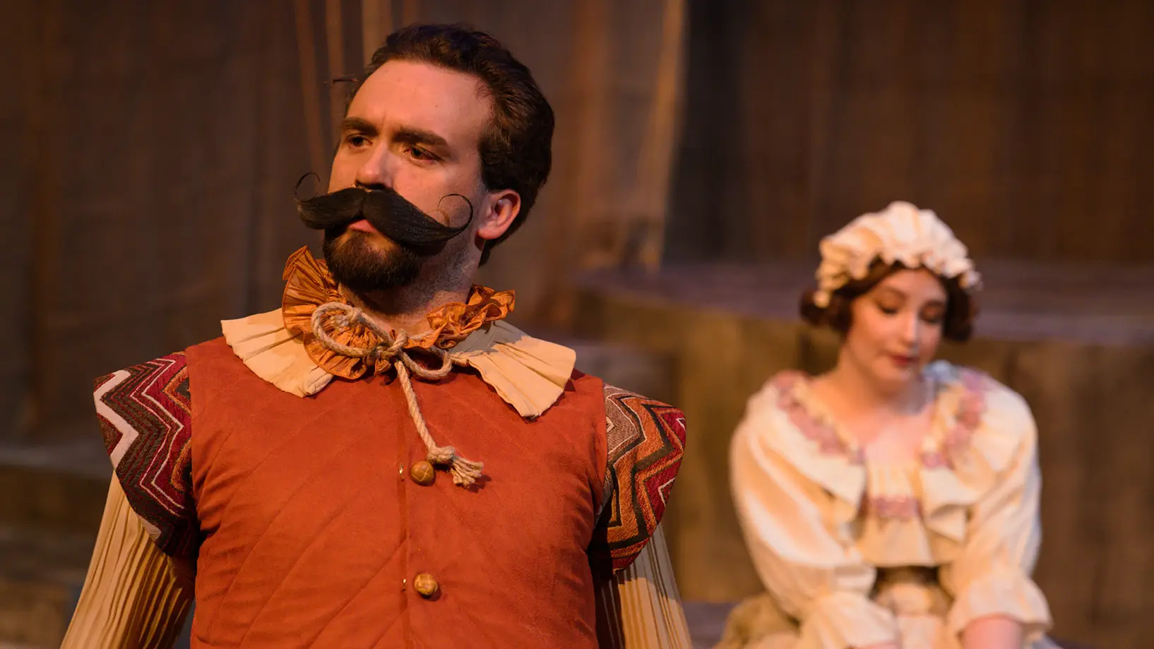 theatre student portraying a settler with a very large mustache