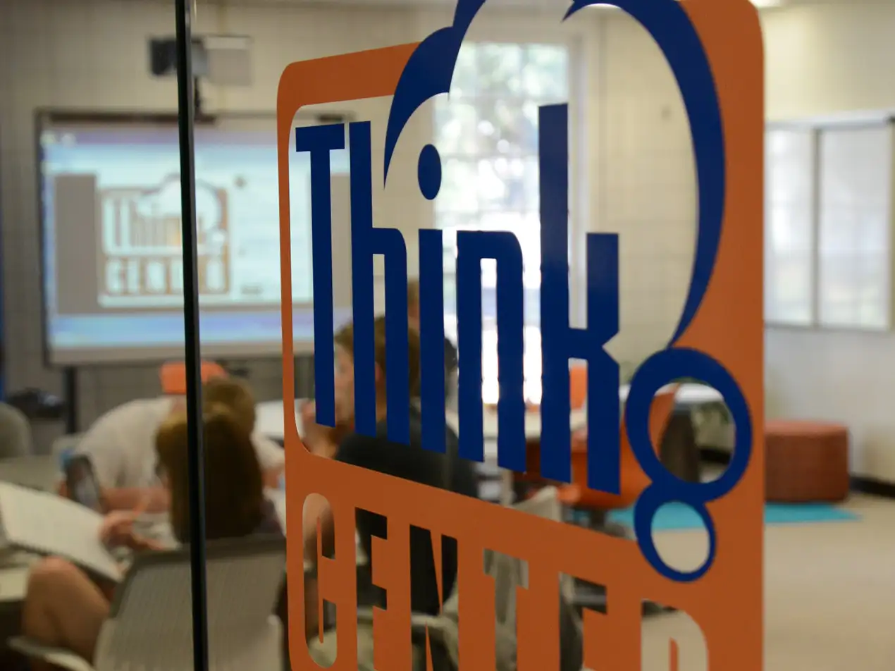 entrance to Think Center with students studying in background