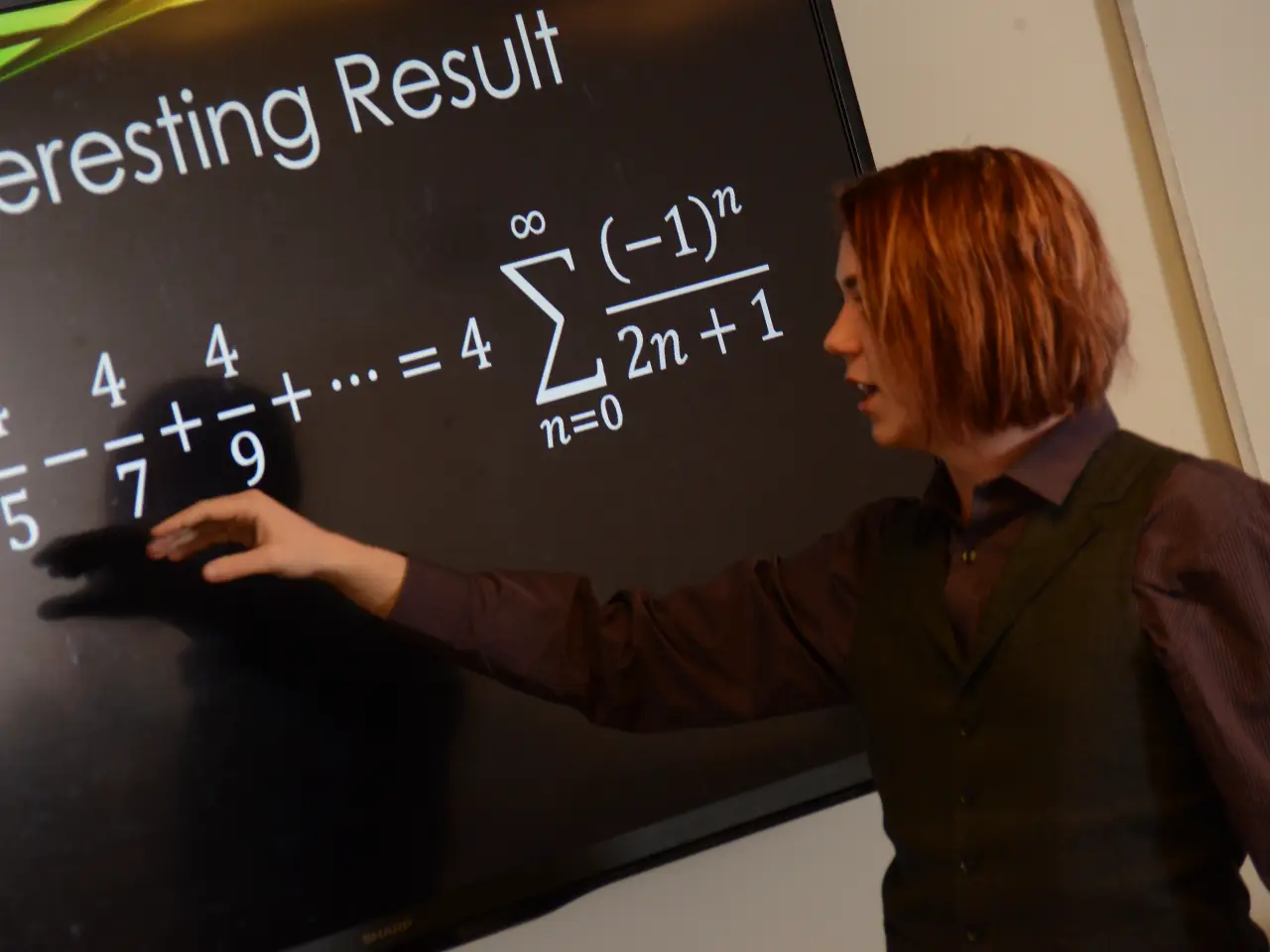 faculty member teaching on touchscreen monitor