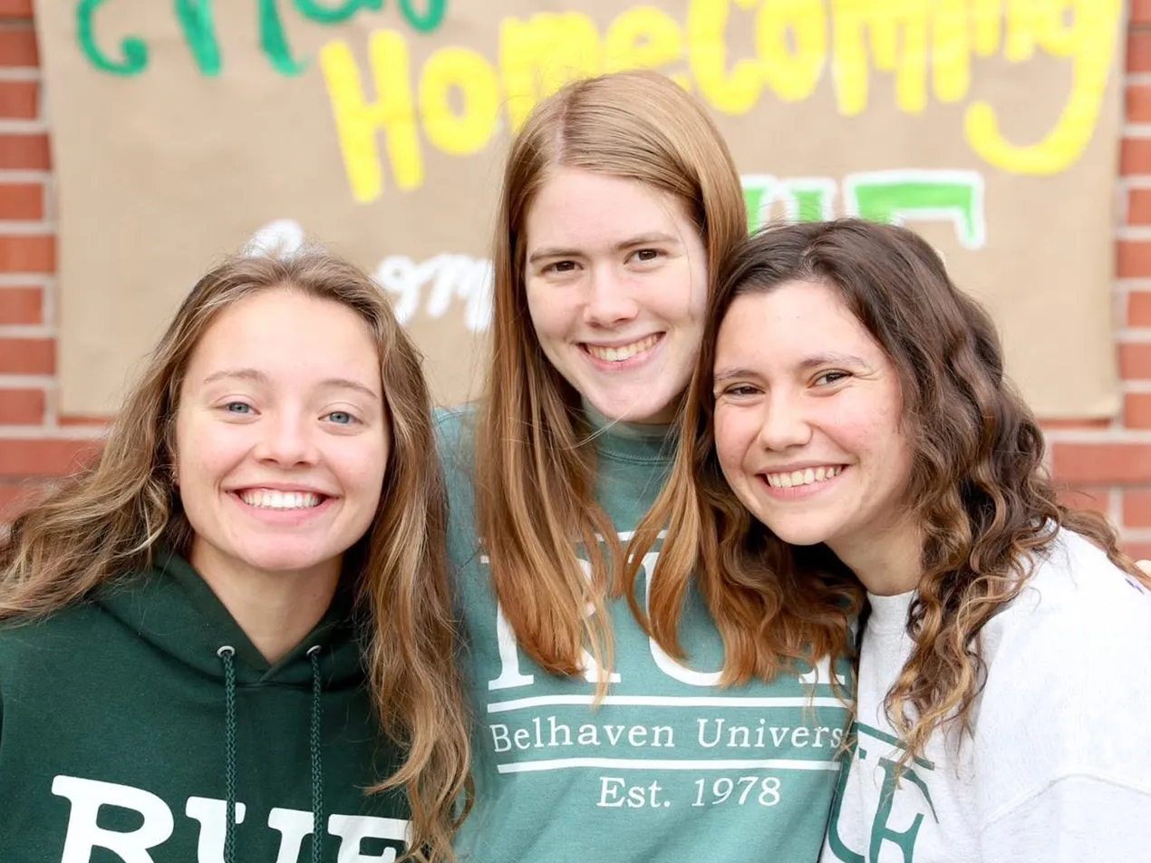 Three female students at Reformed University Fellowship meeting
