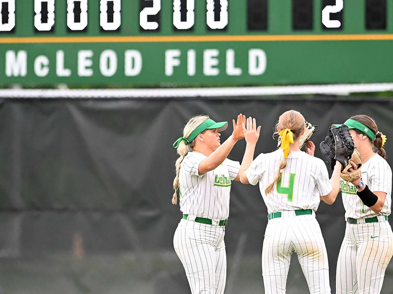 softball players in outfield at mcleod field