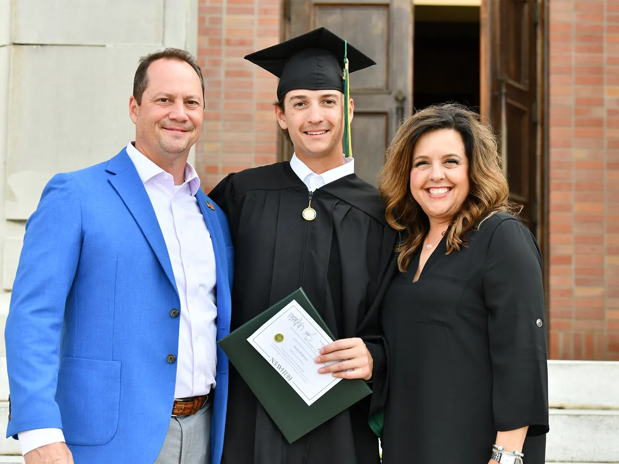Family celebrating students graduation