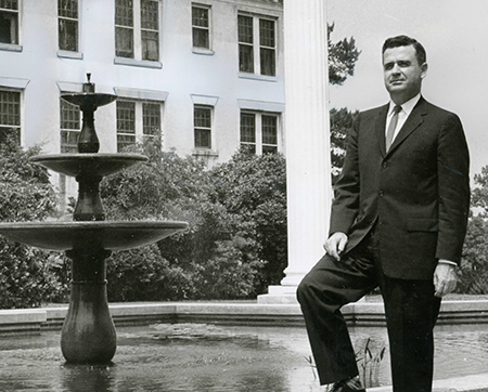 president Howard cleland beside the fountain