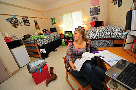 students talking in dorm room