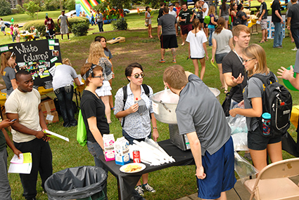 Students mingling at an enrollment event
