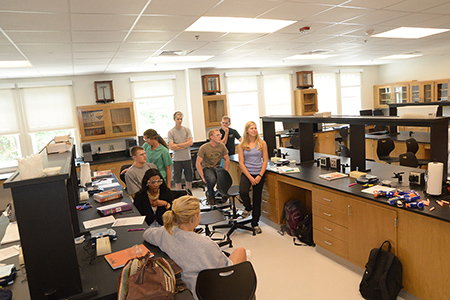 Students at a science discovery day event 